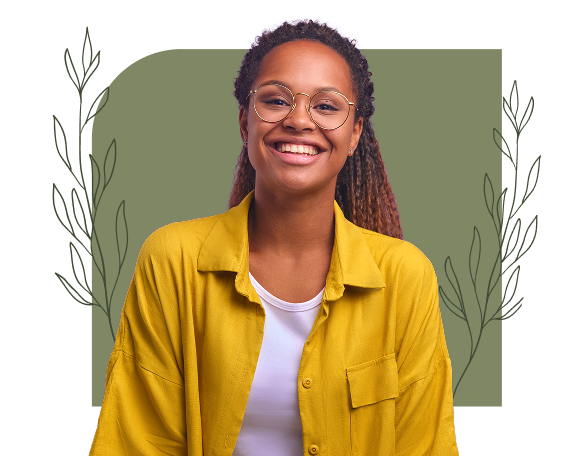 Smiling young woman wearing glasses and a yellow shirt in front of a decorative background